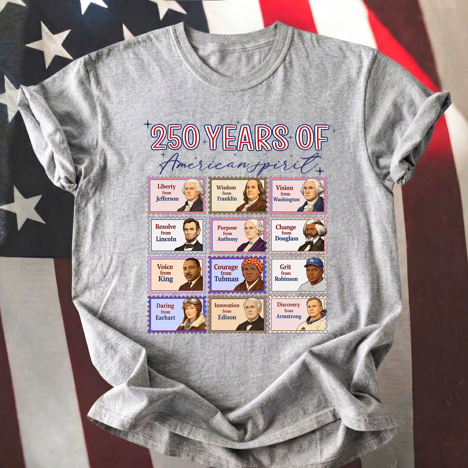 Gray t-shirt with a graphic of 12 historical figures and text '250 Years of American Spirit' on an American flag background.