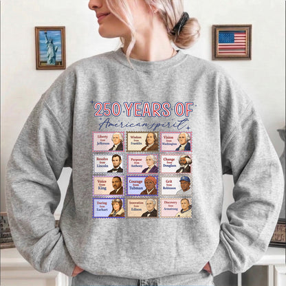 Person wearing a gray sweatshirt with '250 Years of American Spirit' design featuring historical figures.