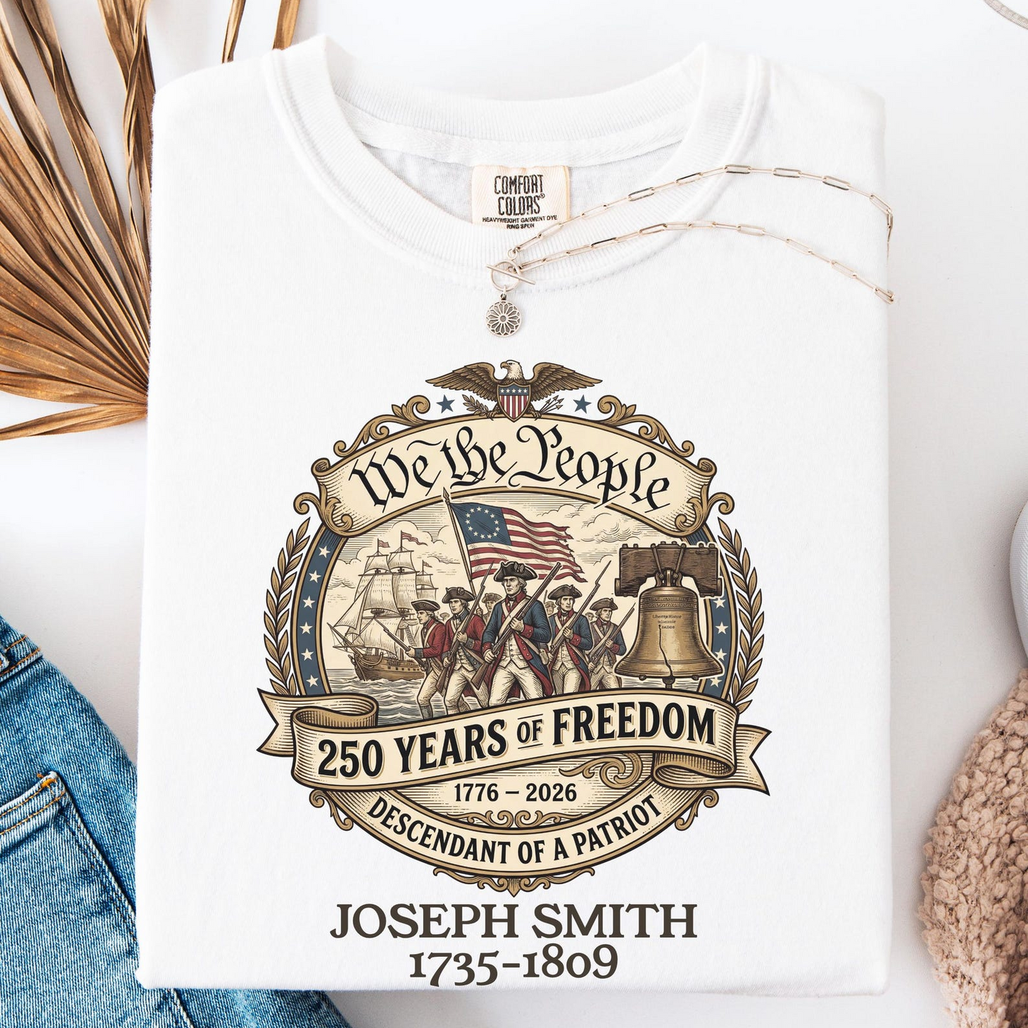 White t-shirt with a graphic design celebrating 250 years of freedom, featuring text and images of historical figures and symbols.
